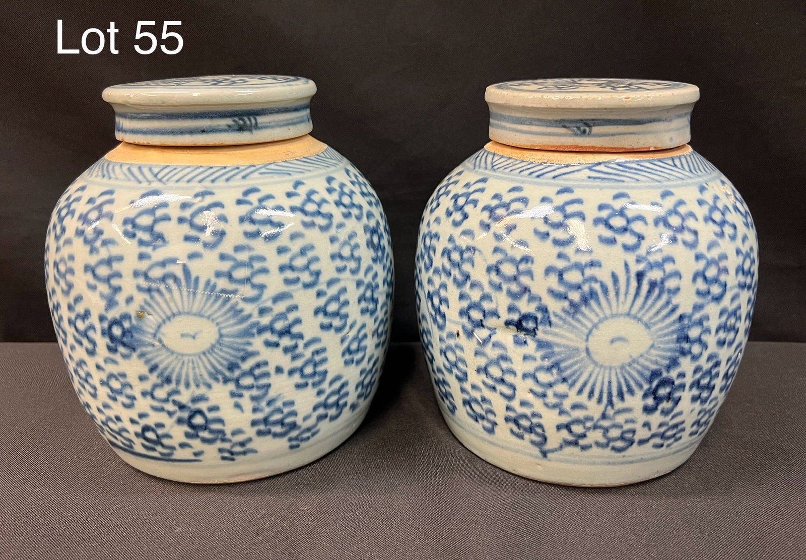 Pair of Early 20th Century Chinese Ginger Jars: Pair of early 20th century Chinese blue and white porcelain ginger jars with lids. 7 1/4" tall each. *notes- minor chip on both.