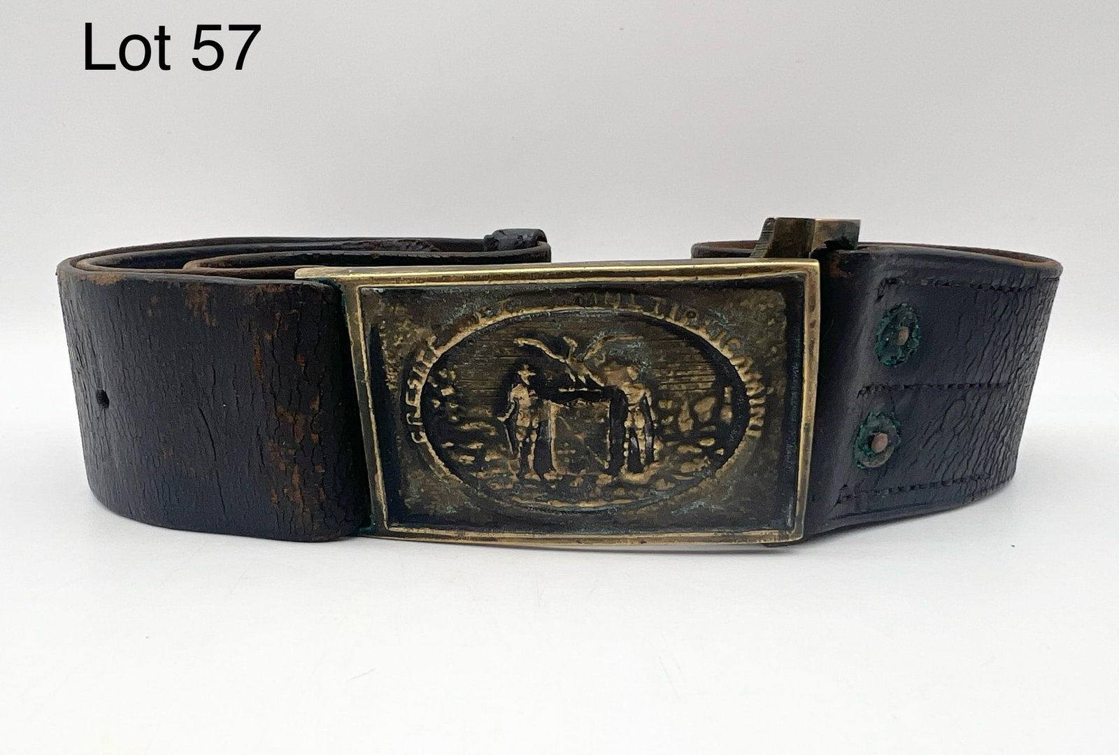 State of Maryland Civil War Buckle and Leather Belt: Civil War cast brass buckle and black leather belt worn by Maryland Confederate volunteer militia units. Back of belt is marked "F.B." Buckle measures 3 1/4" x 1 3/4". Belt is 32". *notes- patina/age