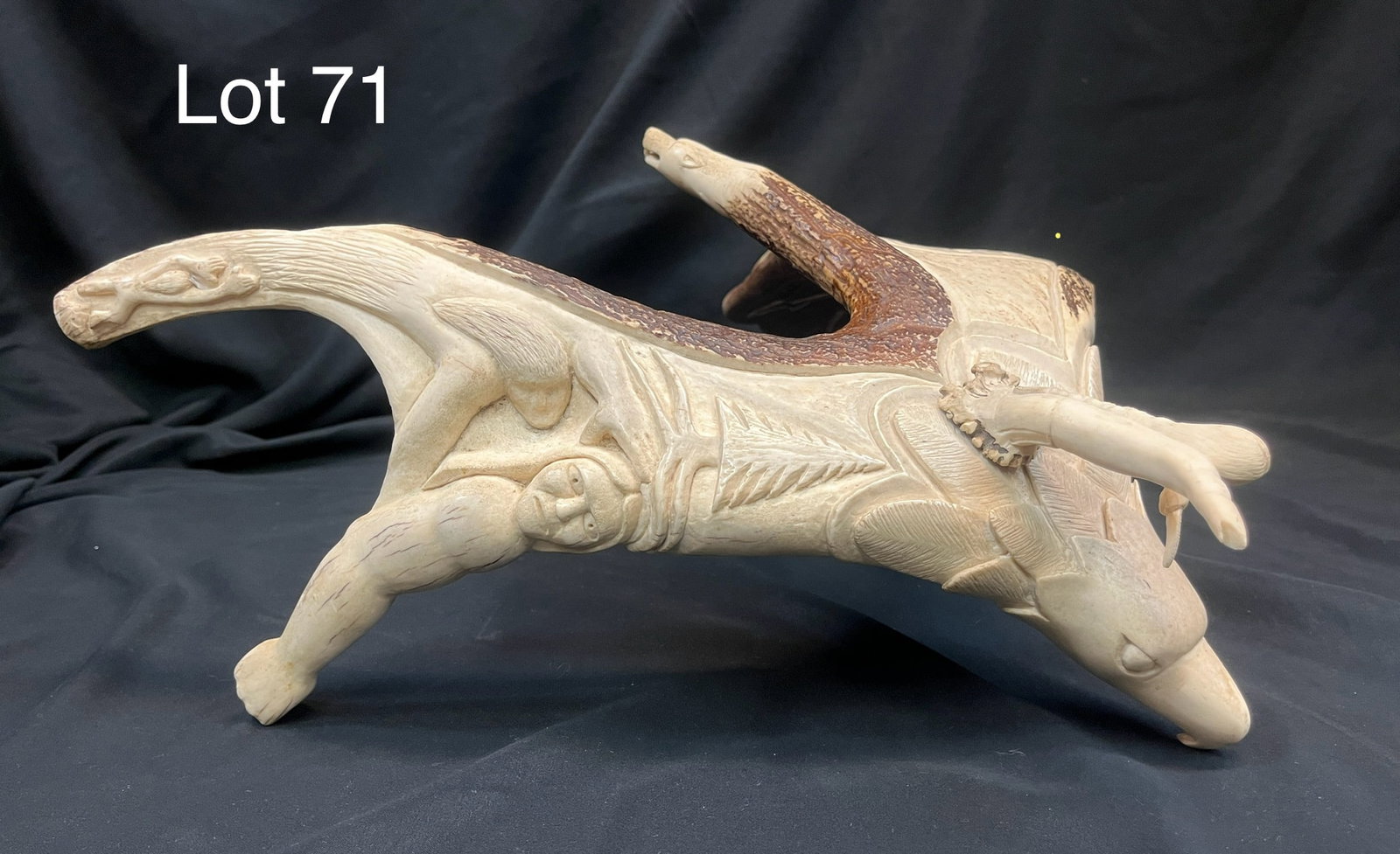 Iroquois Carved Moose Antler by N. Jimerson: A hand carved sculpture taken from a single moose antler reflecting cultural elements from The People of the Longhouse. Figural eagle head and rider with 'wings' and underside depicting natural and sp