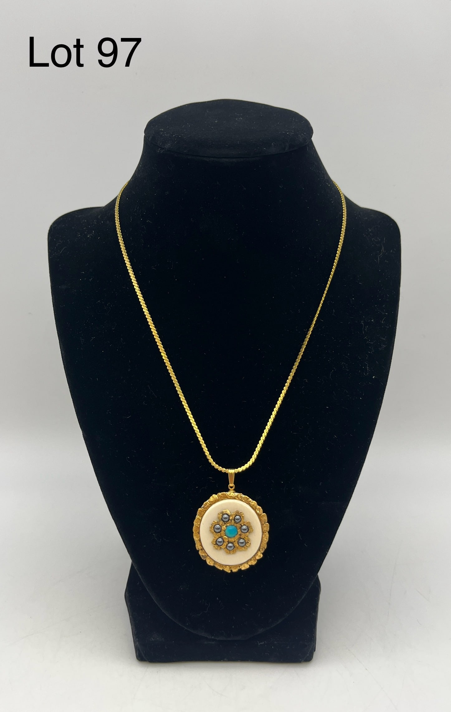 Rare Mammoth Ivory Pendant Necklace with Black Pearls, Turquoise, and 24K Gold Nugget: Rare pendant necklace of a piece of Mammoth ivory set with shimmering black pearls, turquoise, and bordered by small 24k gold nuggets. Chain measures 18"