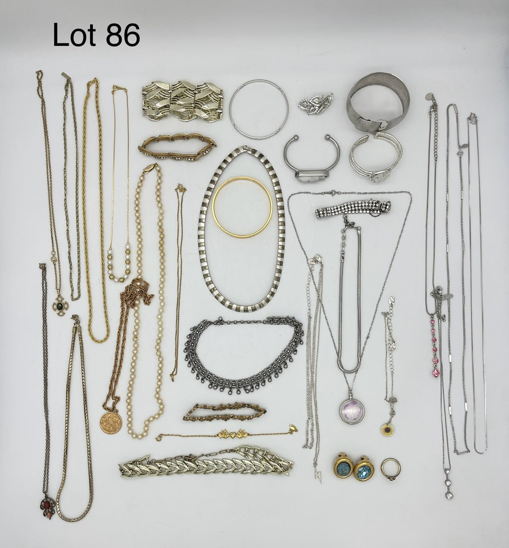 Variety of Signed Costume Jewelry: A nice variety lot of signed costume jewelry in silver and gold tones, including designers like Coro, Avon, Claire's, Kramer, and Kelsey Armielle. Lot also shows a German silver pearl necklace and two