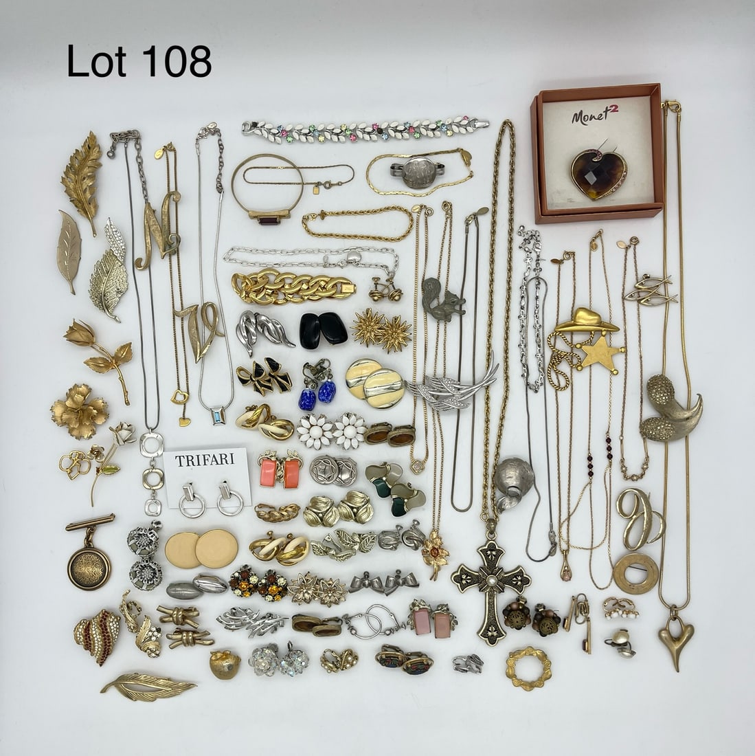 Variety of Signed Costume Jewelry: A selection of signed costume jewelry featuring earrings, brooches, and necklaces. Wide variety of designers including Coro, Bellini, Marvella, Monet, Avon, Haskell, Sarah Coventry, and more.