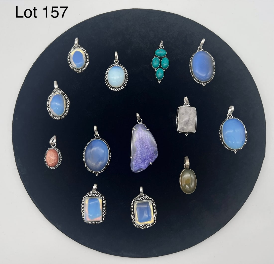Collection of Silver Gemstone Pendants: A colorful variety of silver gemstone pendants. Stone include multiple moonstones, goldstone, amethyst, quartz and more.