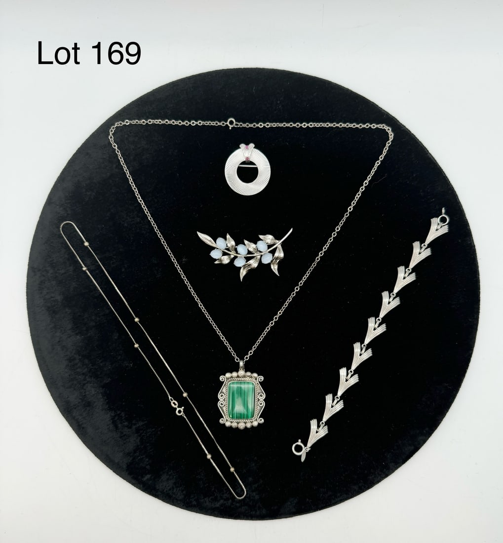 Selection of Signed Sterling Silver Jewelry: A selection of signed sterling silver jewelry, including: a Joe Moquino malachite necklace, a Loran Sim bracelet, a WBE cabochon stone brooch, and more.