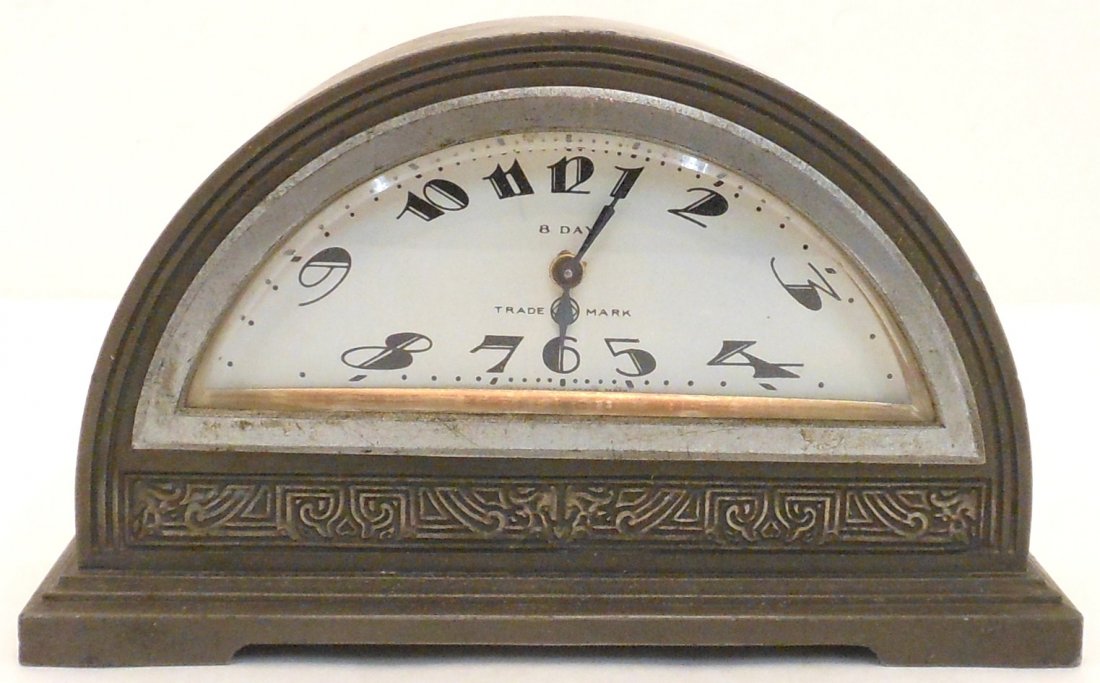 Seikosha Art Deco Wind-up Desk Clock: 4 3/4" tall X 8 1/8" long X 2 3/4" deep, Art Deco spelter novelty desk clock made by Seikosha (Seiko). Spelter case in a half moon design with a fabulous half moon metal Art Deco dial, marked: 8 Day T