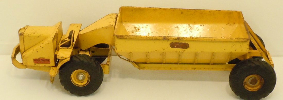 Doepke Model Pressed Steel Wooldridge Earth Hauler: 25" long X 7 3/4" wide X 6 1/2" tall, Doepke Model Toys of Heavy Duty Construction Vehicles, circa 1946, Pressed Steel Model of a Wooldridge Belly Drop Earth Hauler, solid rubber Good Year Tires, deca