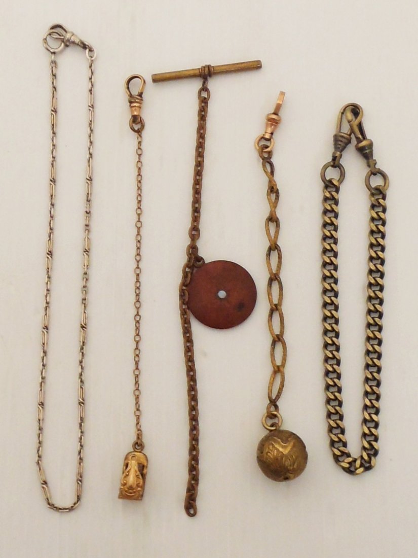 Lot of Vintage Pocket Watch Chains: Lot of five. 10" heavy links with two clips. 5 1/2" large link with clip and round fob. 6" with 'T' bar and fob with pearl. 6" fine link with two clips marked 1904. 14" long linked silver colored mark