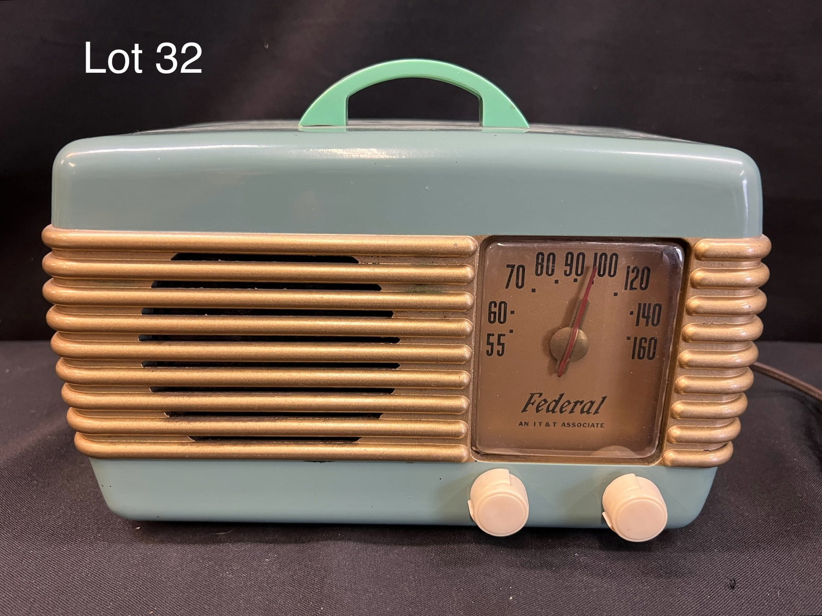 1947 Federal 1040-TB Tube Radio: A 1947 Federal 1040-TB tube radio. A seafoam plastic table radio with gold toned grill lines, right front dial and 2 knobs.