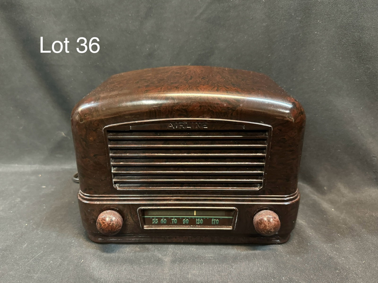 1940 Airline 04BR-511A Tube Table Radio: A 1940 Airline model 04BR-511A tube table radio. Bakelite, art deco design, midget, slide rule dial w/ horizontal louvers, 2 knobs, BC, 5 tubes, AC/DC