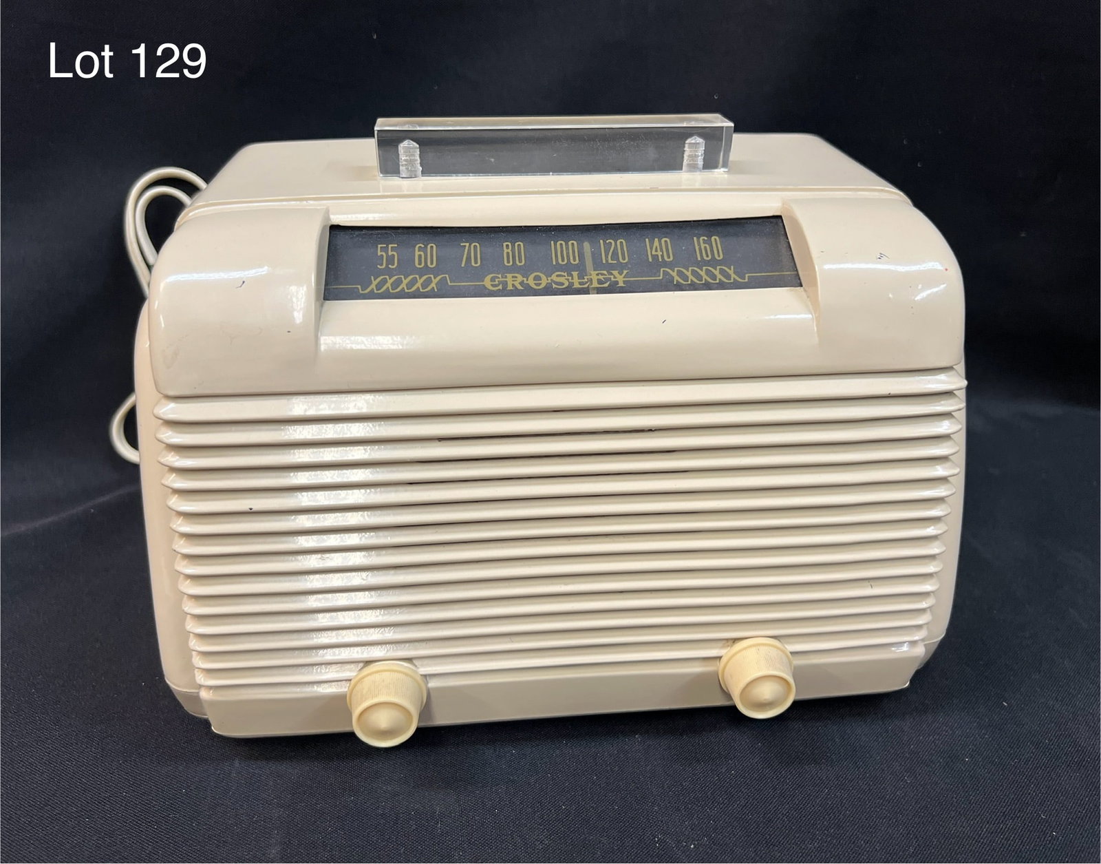 1946 Crosley 56-TW Tube Radio: A 1946 Crosley 56-TW ivory plastic table tube radio. Front square dial, right/left wrap around grill bars, base, 3 knobs, BC, SW, AC/DC.