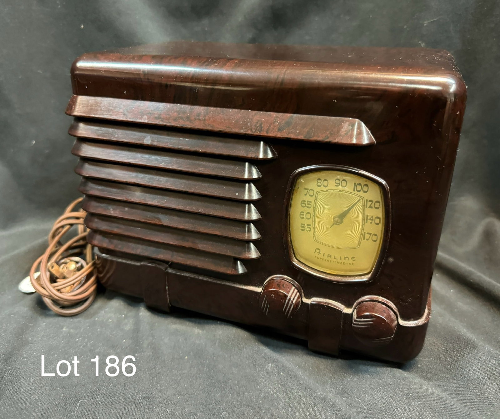 1939 Airline 62-325 Tube Table Radio: A 1939 Airline model 62-325 tube table radio. Bakelite, right side square dial, wrap-around grille, 2 knobs, 5 tubes.