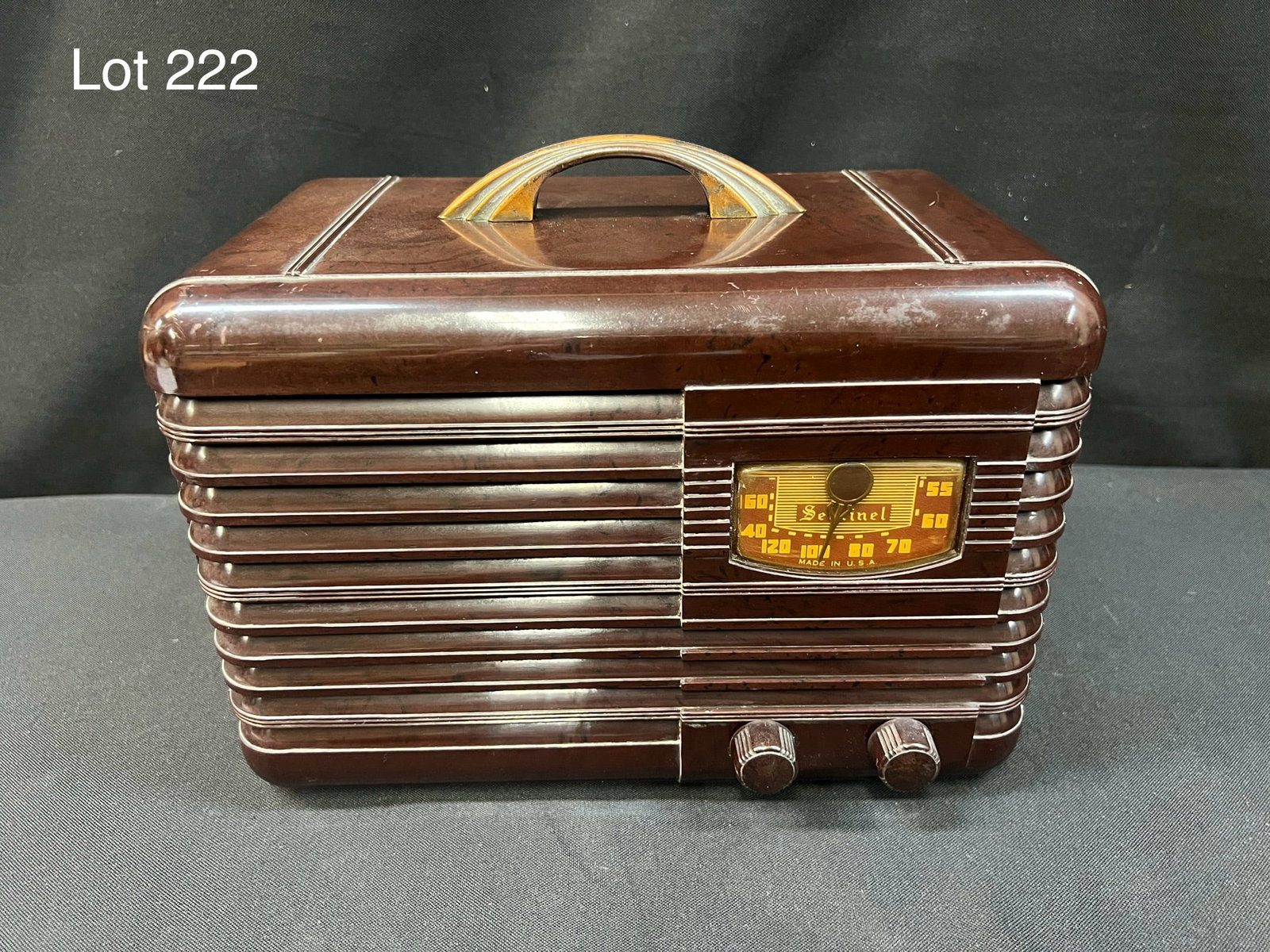 1939 Sentinel 163ULT2165 Tube Radio: A 1939 Sentinel 163ULT2165 brown plastic tube table radio. Top handle, 2 knobs.