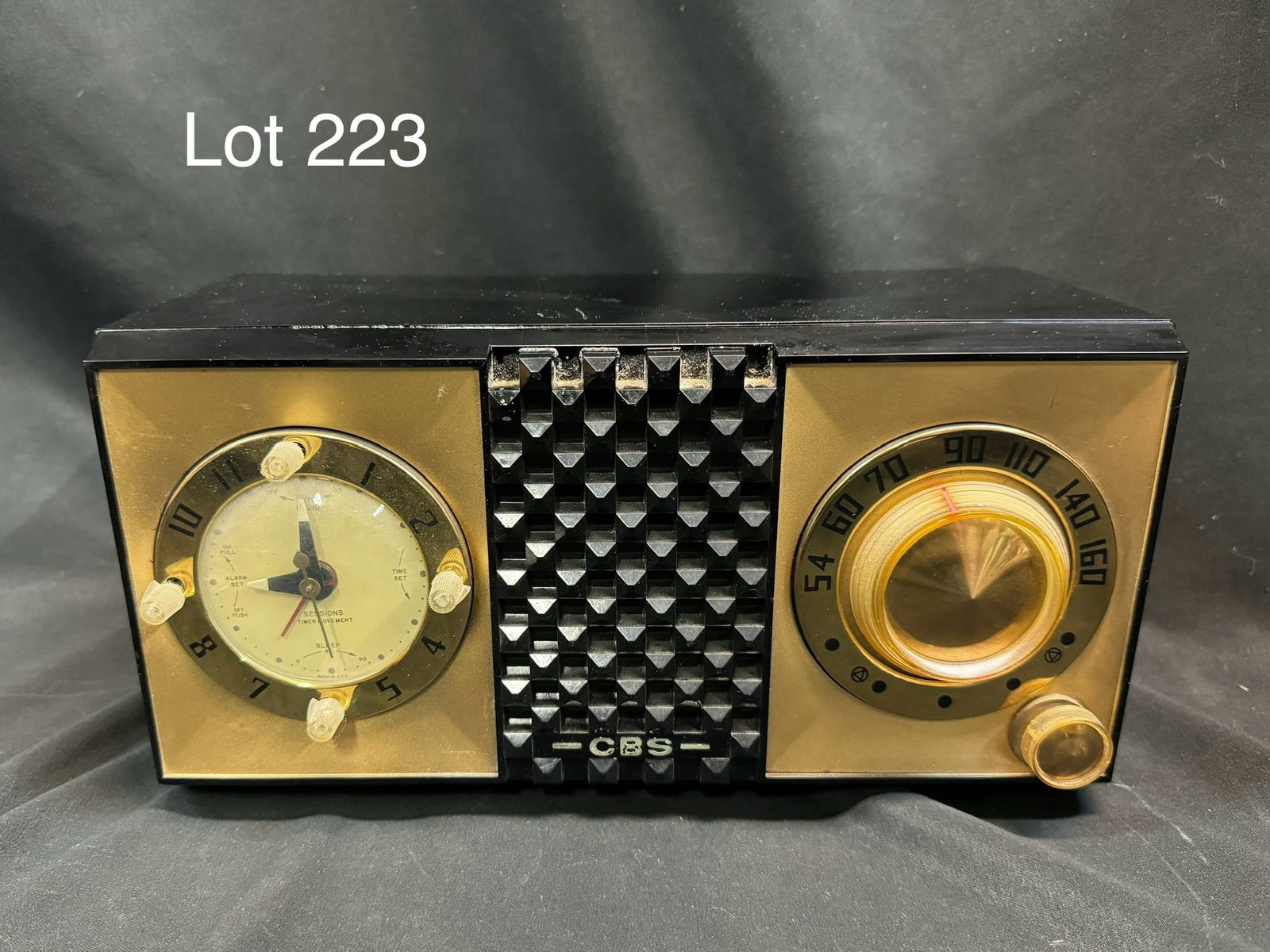 1956 CBS 5440 Tube Clock Radio: A 1956 CBS-Columbia model 5440 tube clock radio. Table-C, plastic, round alarm clock on left with dial on right, center checkered pattern, BC, 5 tubes, AC