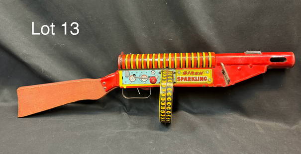 Louis Marx Co. Tin Litho FBI G-Man Sparkling Toy Machine Gun: A Marx G-Man tin windup machine gun toy circa 1930's. Features a wind-up mechanism that allows it to move and make realistic gun and siren sounds. Wooden stock and decorated with tin litho 'G-Man'