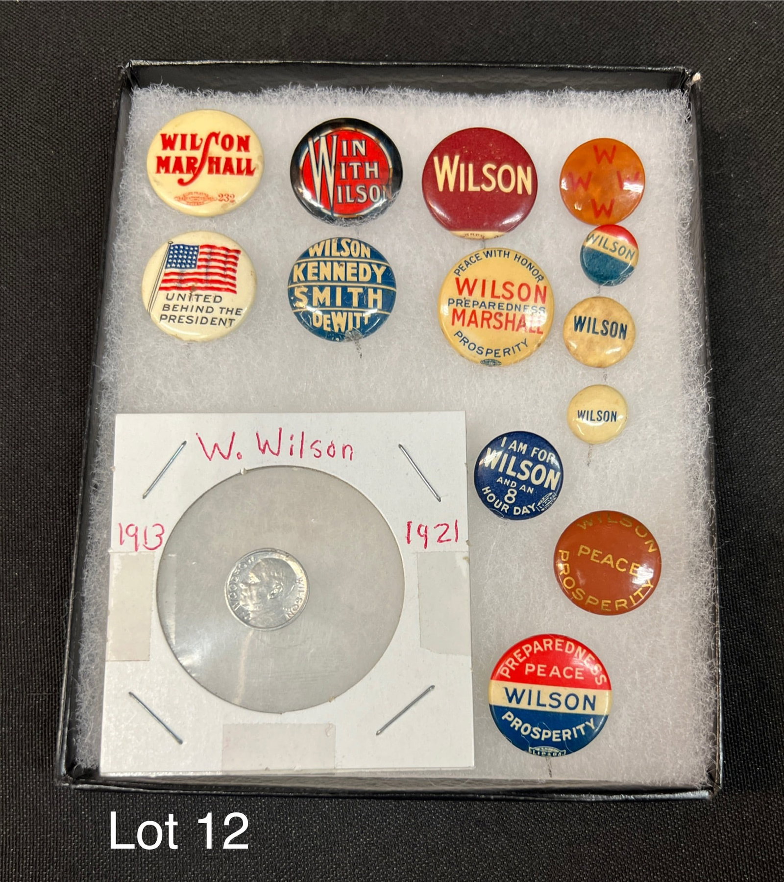 Lot o13 Woodrow Wilson Original Political Pins and One Lucky Play Money Wilson Coin: A lot of 14 pins and play money relating to President Woodrow Wilson, circa 1913-1921.