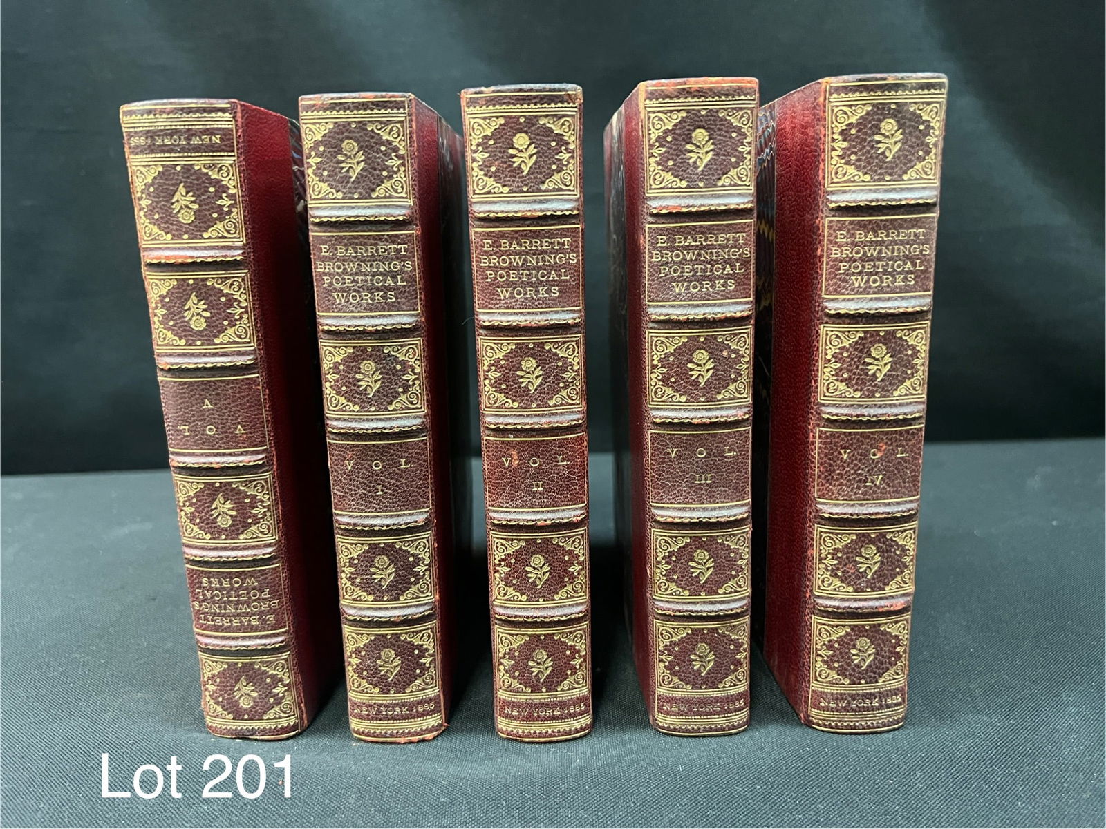 Elizabeth Barrett Browning's Poetical Works, 1885: New York, Dodd, Mead, 1885. First Edition. Hardcover. 5 Volume set. Near fine. Marble boards with gilt designs on the spines. Some splitting in spines. Bookplate of Boylston Adams Beal. In 1916 he was