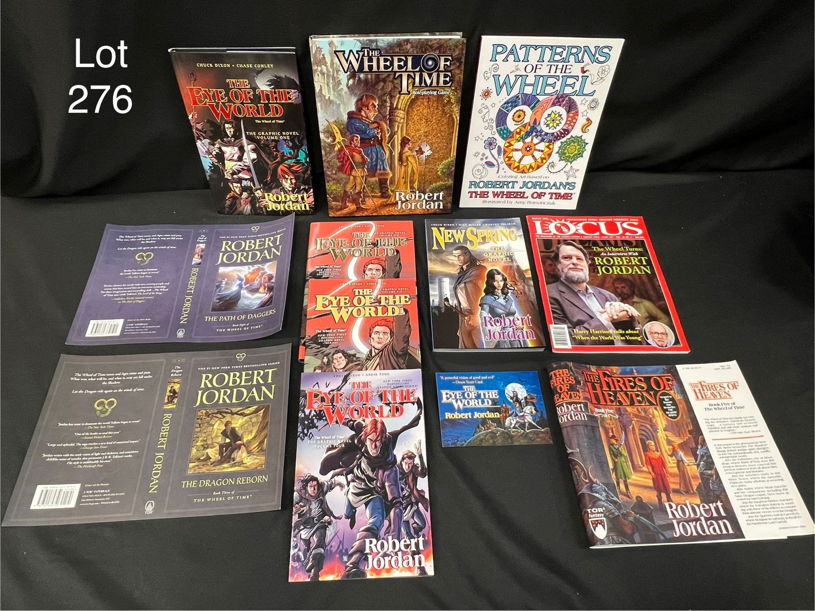 Variety of Books and Memorabilia Related to 'The Wheel of Time' Series (1 of 15)