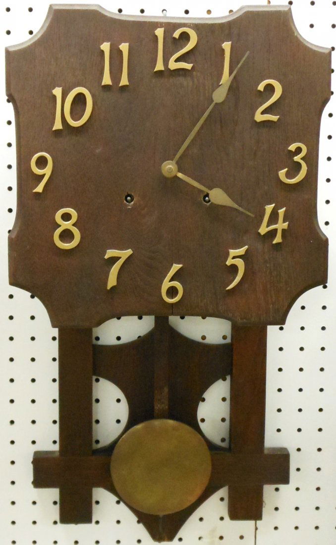Mission Wall Clock: 24" tall X 13" wide X 5 1/4" deep, time and strike, traditional mission style, wood face has a small split through the '6' and the bottom has a missing tip, with minor adjustments/repair could be work