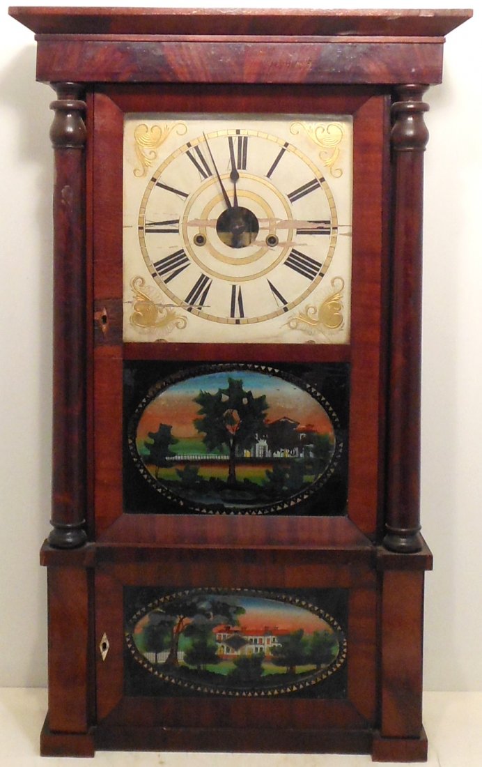 Forestville Ogee Clock: 34 1/4" tall X 20" wide X 6 3/4" deep, Forestville 'ogee' style weight driven wall clock, case has scuffs, dings and veneer loss, upper glass is cracked, reverse painted glass both have loss, label in