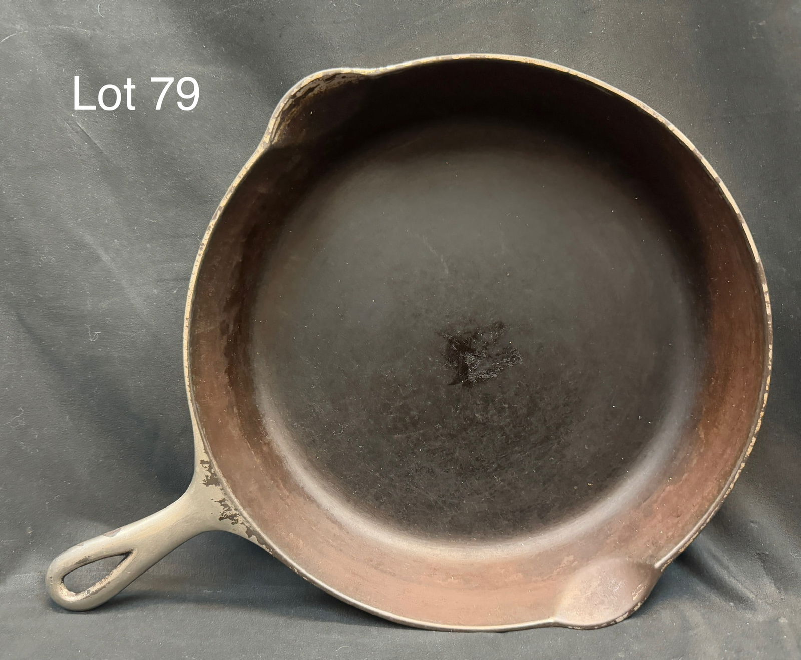 Vintage Griswold Size 9 Cast Iron Skillet: A vintage Griswold Size 9 No. 710 cast iron skillet. Fair condition with patina from use, measures 12 1/4" x 16 1/4"