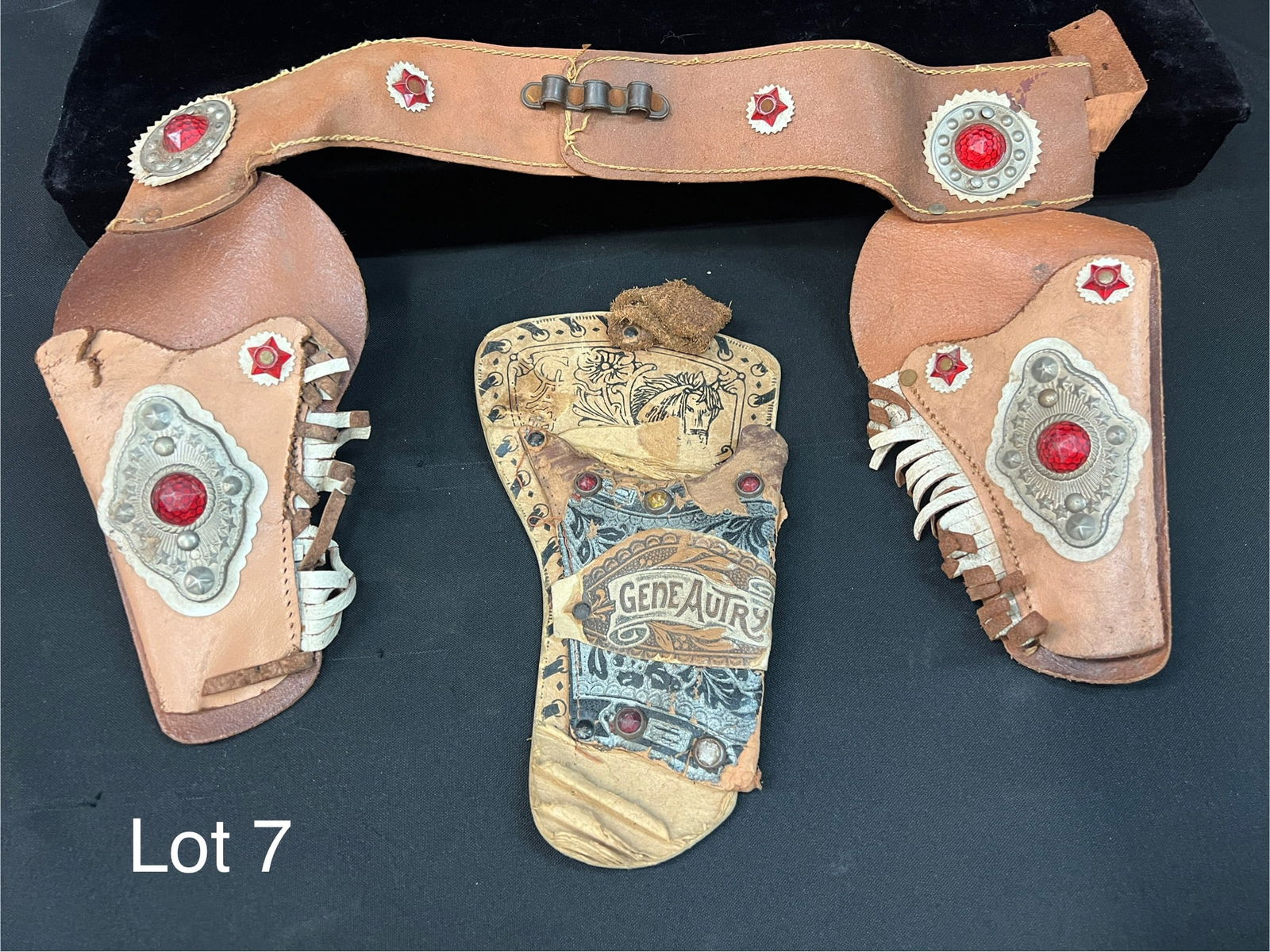 Vintage Gene Autry Toy Gun Holsters: Group of two mid 20th century Gene Autry toy pistol holsters. *notes- both items have some wear and soil.