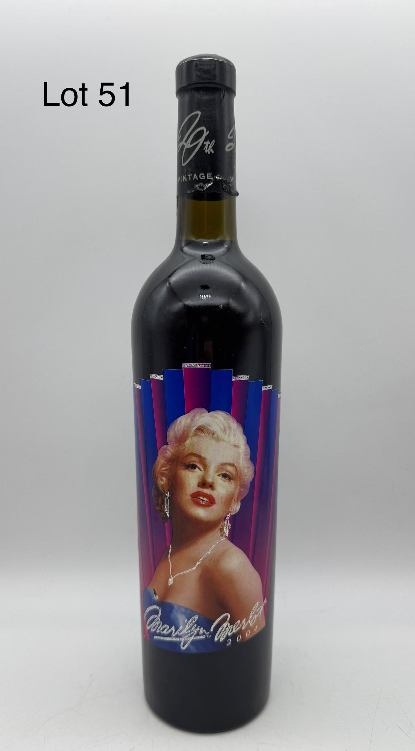 Bottle of 2004 Marilyn Merlot: A never-opened bottle of 2004 Marilyn Merlot, their 20th vintage. Good condition, some damage on base of seal.