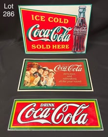 Group of Coca-Cola Signs