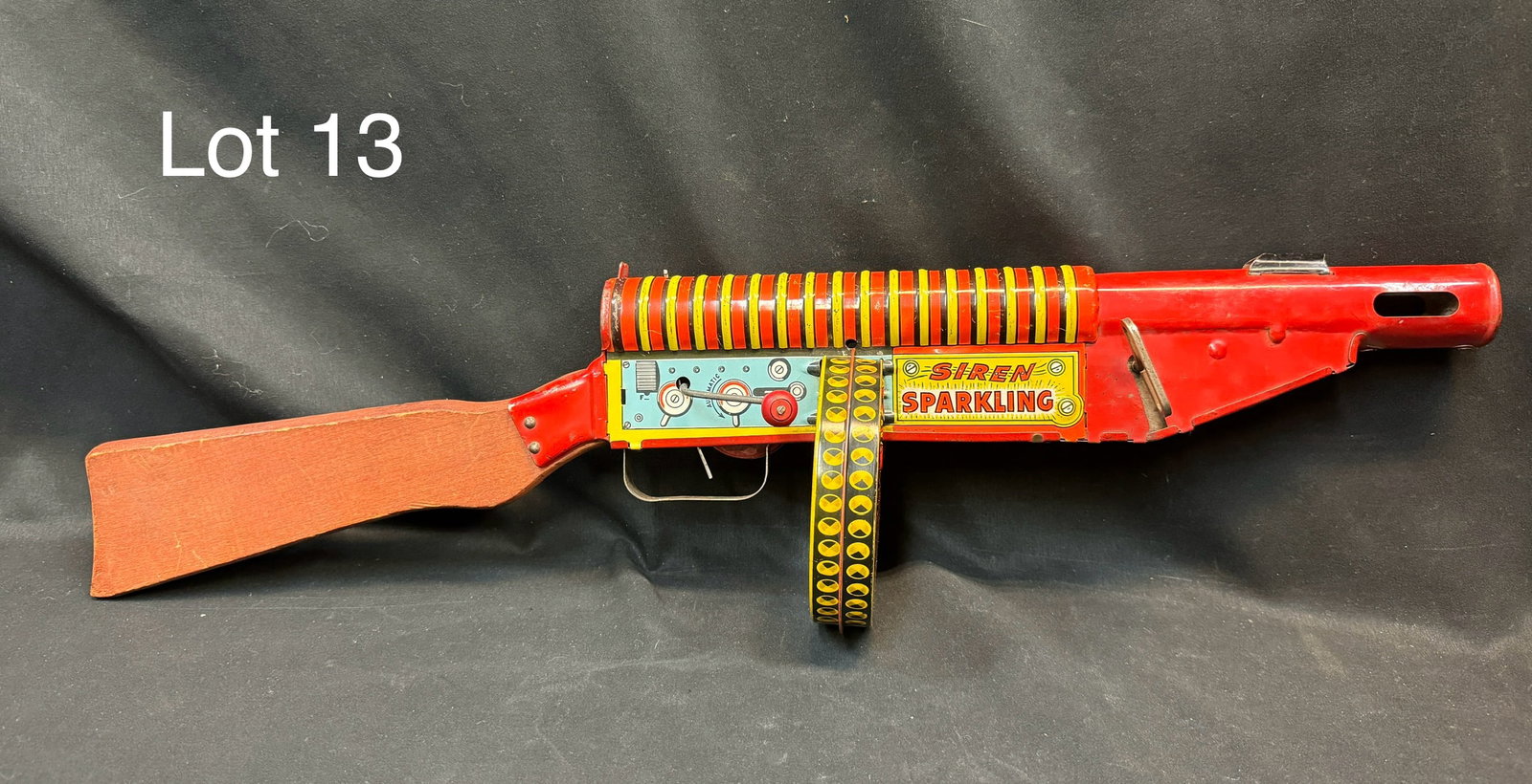 Louis Marx Co. Tin Litho FBI G-Man Sparkling Toy Machine Gun: A Marx G-Man tin windup machine gun toy circa 1930's. Features a wind-up mechanism that allows it to move and make realistic gun and siren sounds. Wooden stock and decorated with tin litho 'G-Man' col