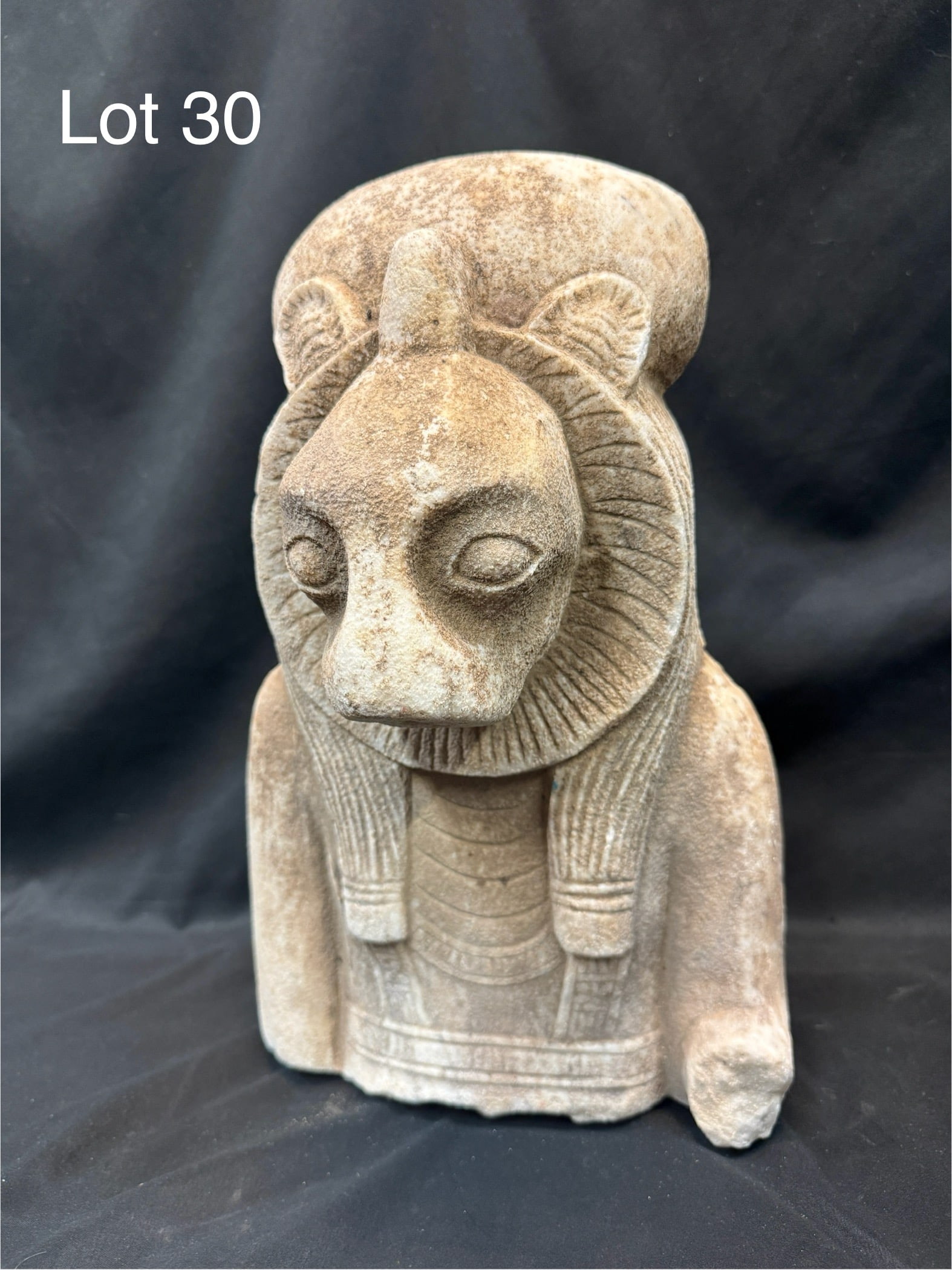 Stone Bust of Sekhmet: A carved stone bust of the Egyptian goddess Sekhmet. Measures 15" tall, 9 1/2" across