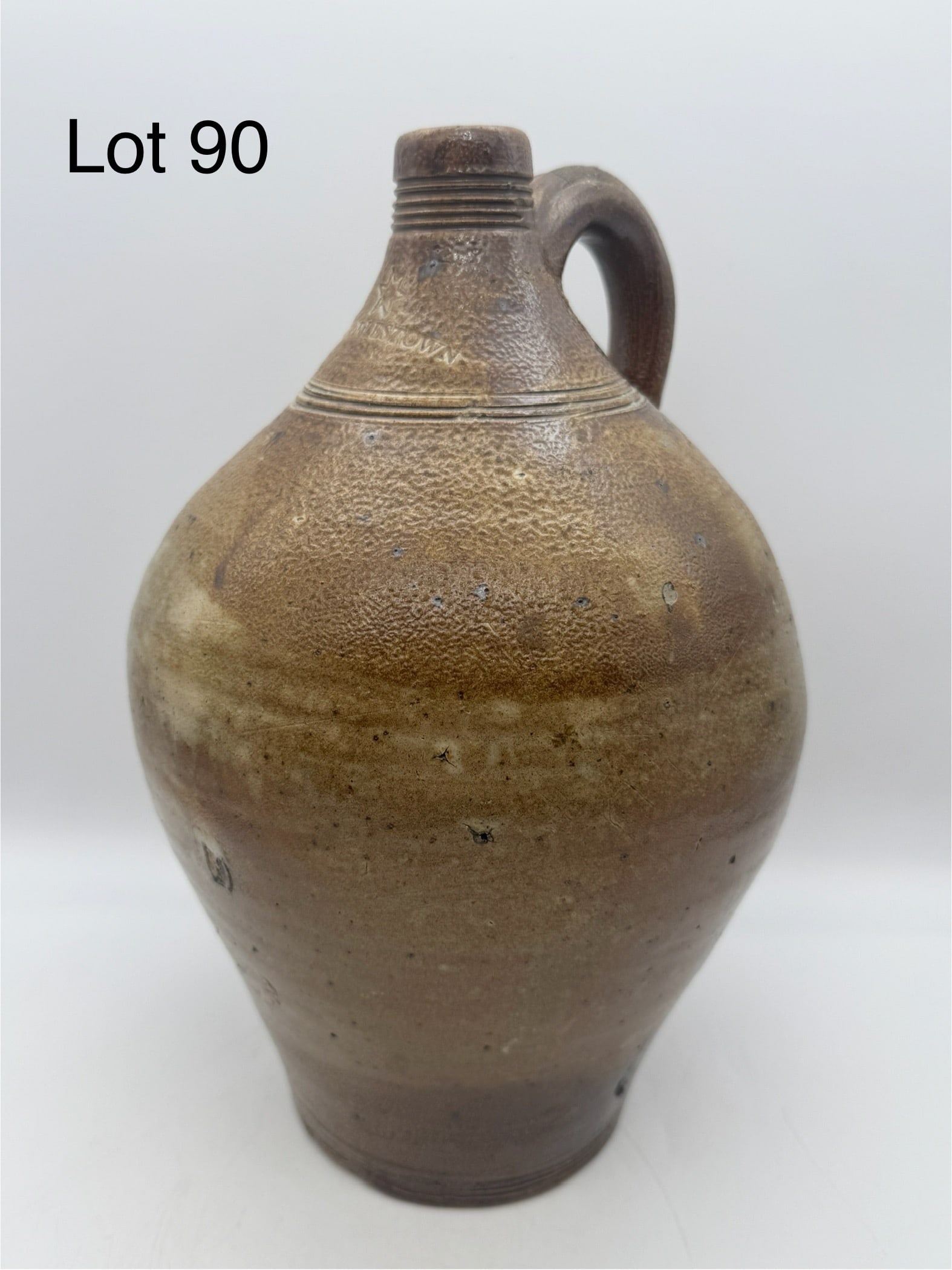 Early Charlestown F. Carpenter Stoneware Jug: This lot is a circa 1810 Charlestown stoneware jug attributed to Frederick Carpenter. Impressed Charlestown with star sitting above. Incised banding on mouth, shoulder, and bottom. Measures 13"H x 8"D