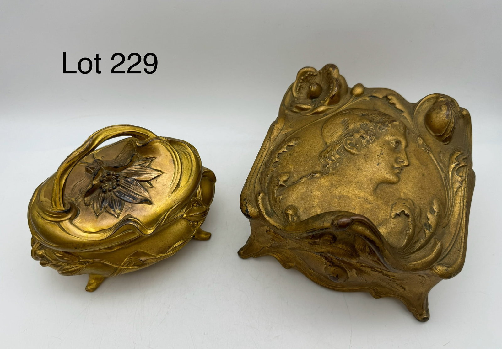 Elegant Set of Art Nouveau Gold Tone Jewelry Trinket Caskets: A beautiful selection of Art Nouveau gold tone jewelry caskets. Varying sizes including makers marks from 'NB Rogers Silverplate, Danbury Conn' (4.5" x 6"x 6"), 'W.B. Mfg. Co. 324' (4" x 6"x 4"), and 