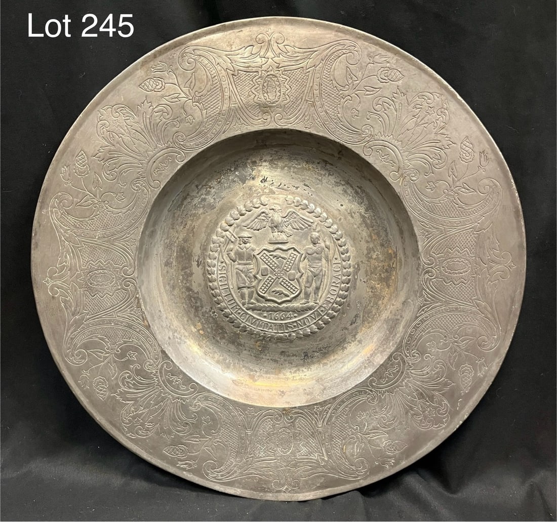 Vintage New York City Decorative Pewter Charger: A limited edition decorative pewter charger decorated with the seal of the City of New York, as well as other etched floral designs. These plates were given as gifts by former mayor Robert F. Wagner t