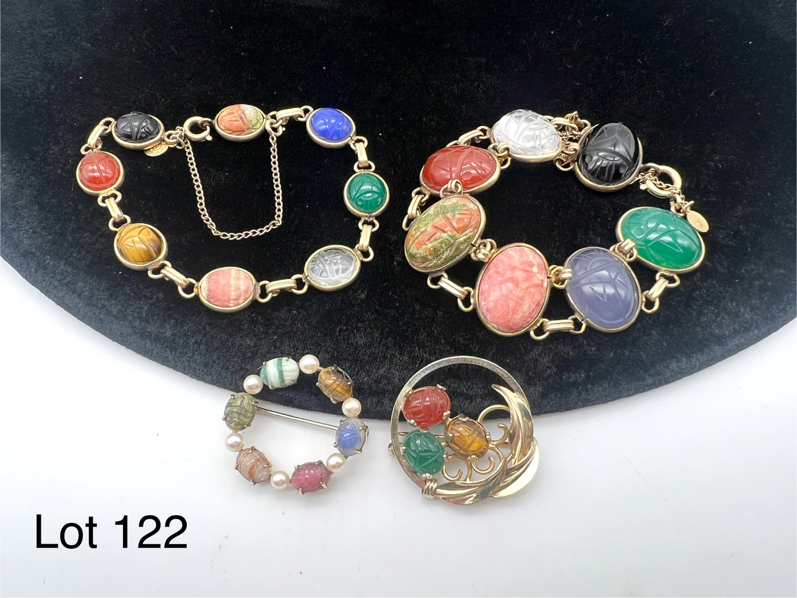 Signed Gold Filled Scarab Jewelry Collection: A lot of vintage gold filled scarab jewelry including two brooches and two bracelets. Brooches are marked "Burt Cassell" and "WRF", bracelets are marked "CC".