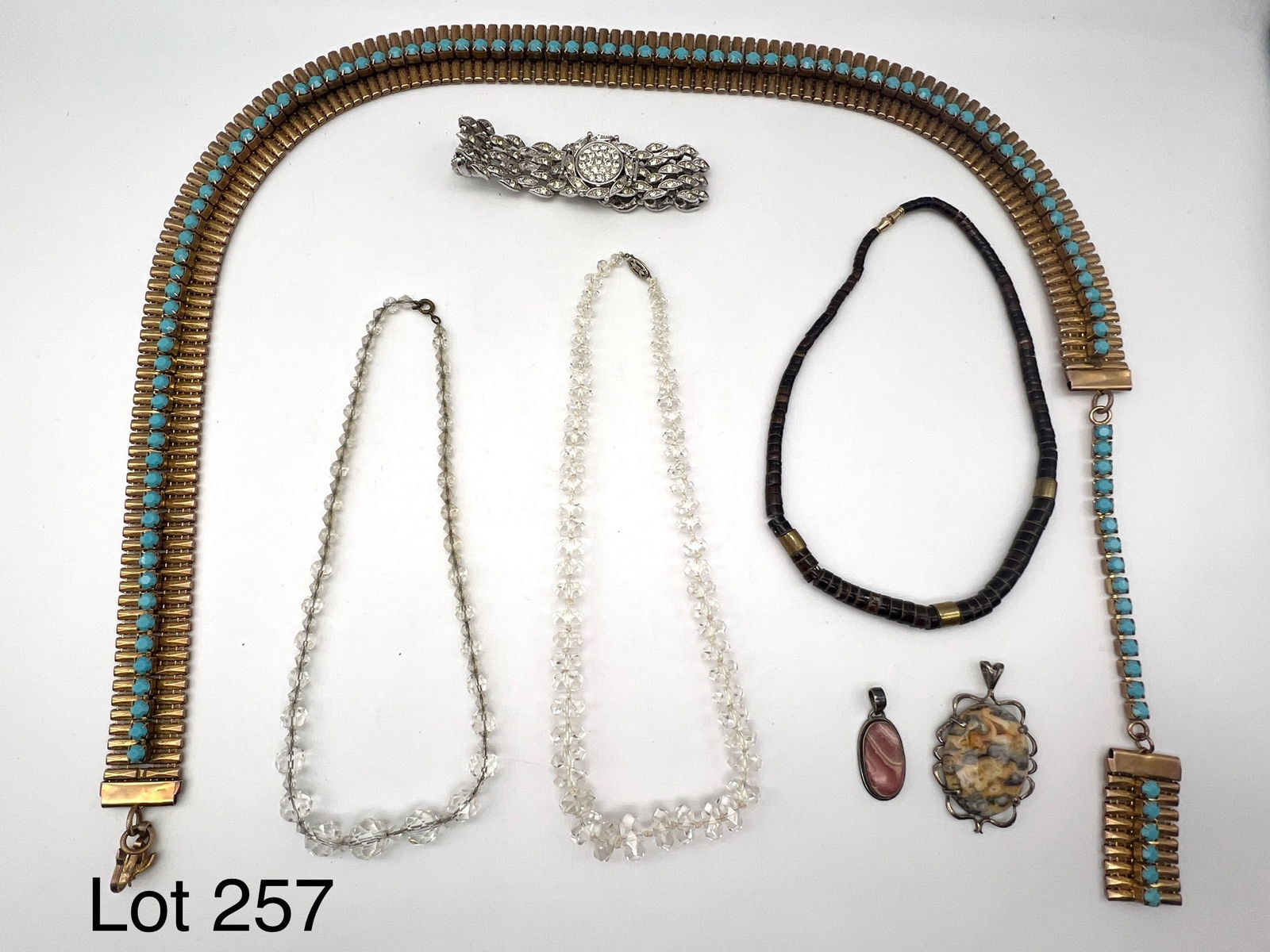 Vintage Coro Watch, Sterling Rhodochrosite Pendant and More: Vintage Coro watch and sterling rhodochrosite pendant together with 3 necklaces, agate pendant, and groovy metal vintage chain belt