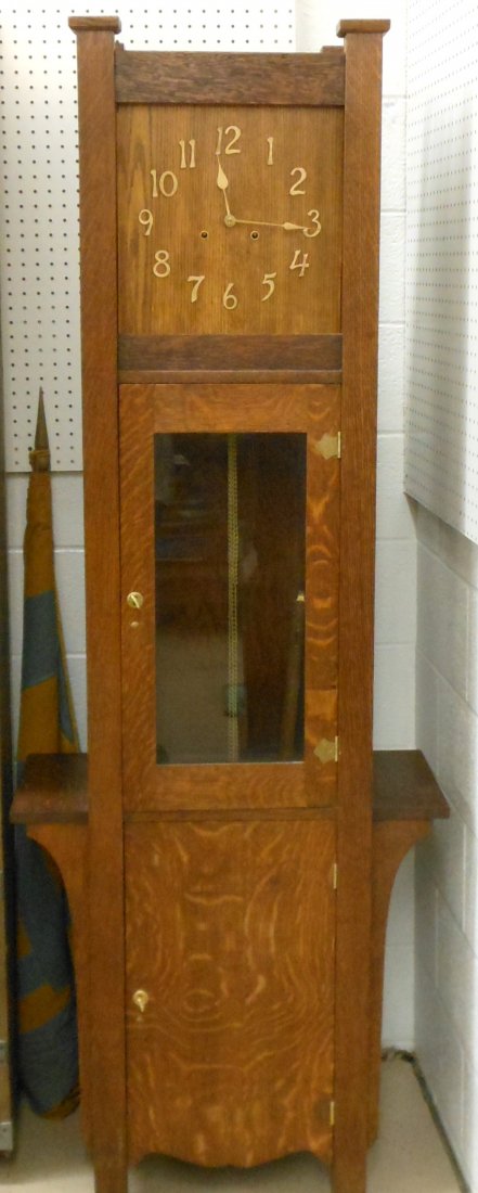 Oak Mission Grandfather Clock: PICK UP ONLY 76" tall X 28" wide X 12" deep, Oak Mission style grandfather clock, 13 1/2" face has a lighter finish, two 5 3/4" shelves at 28" from the floor, brass hardware, locking access doors with