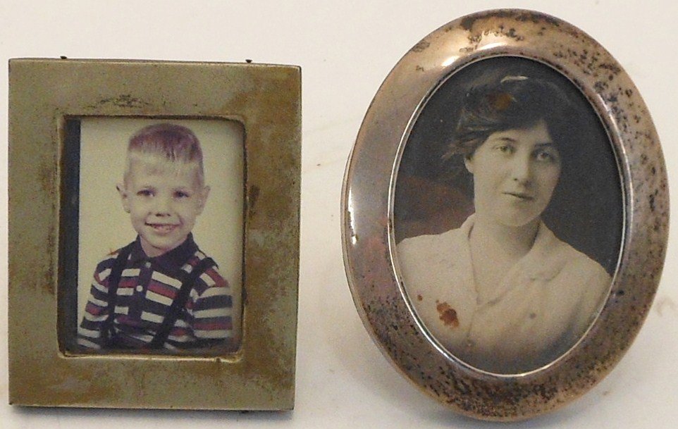 Lot of 2 Vintage Sterling Silver Picture Frames: 1.) Oval Sterling Silver Picture Frame with a picture of a Woman. 3 1/2” X 2 3/4”. Marked and hallmarked “Sterling 4475”. 2.) Square Sterling Silver Picture Frame with picture of a Boy. 3” X
