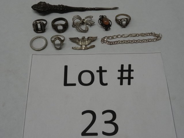 Jewelry Lot: Lot of 10. Sterling ring (size 8 1/2), settings (2 size 7 and 2 size 9), 3 small pins, a bracelet (7 1/2"), a sterling handled tool (5").