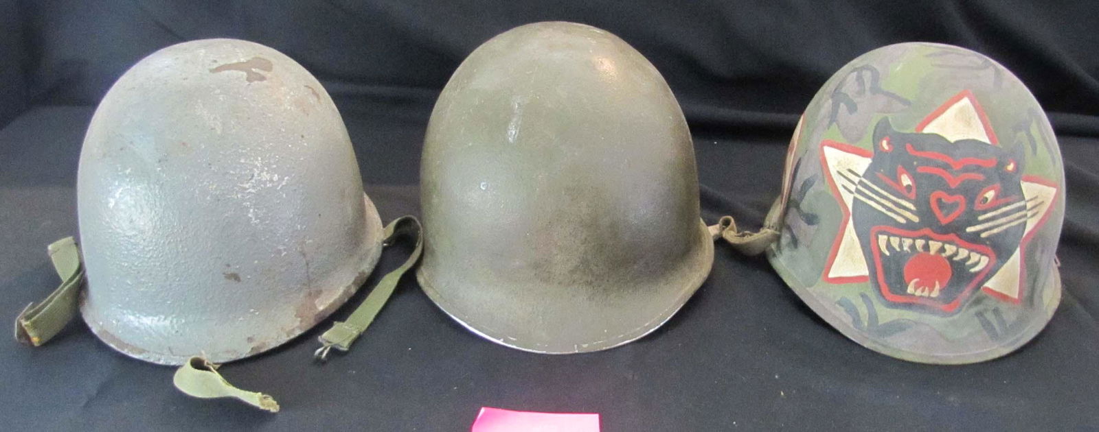 Militaria;  Vintage US M1 type helmets.  Lot of 3 similar examples.  One painted (Panther #25 on (1 of 2)