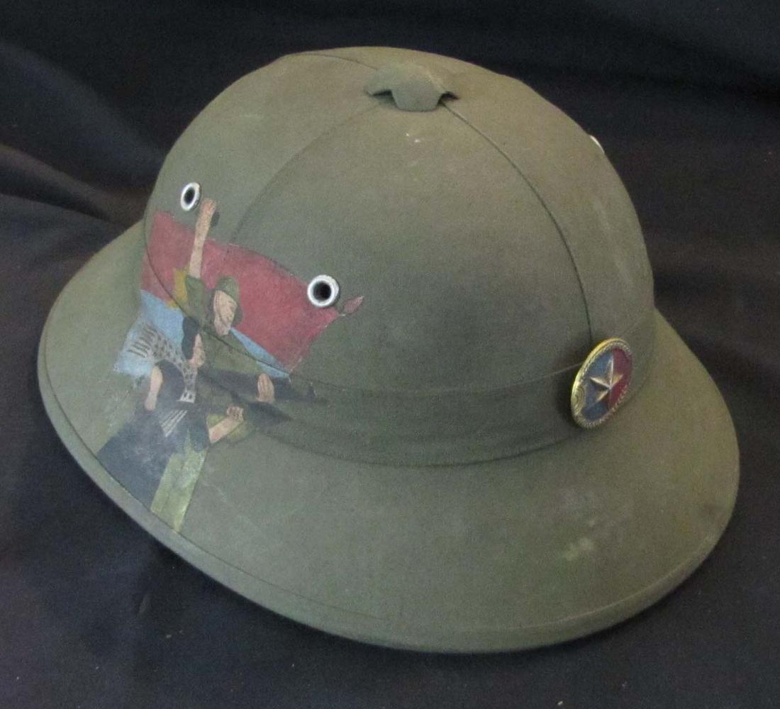 Militaria;  Helmet - North Vietnamese Army Pith Helmet with red star badge. (1 of 2)