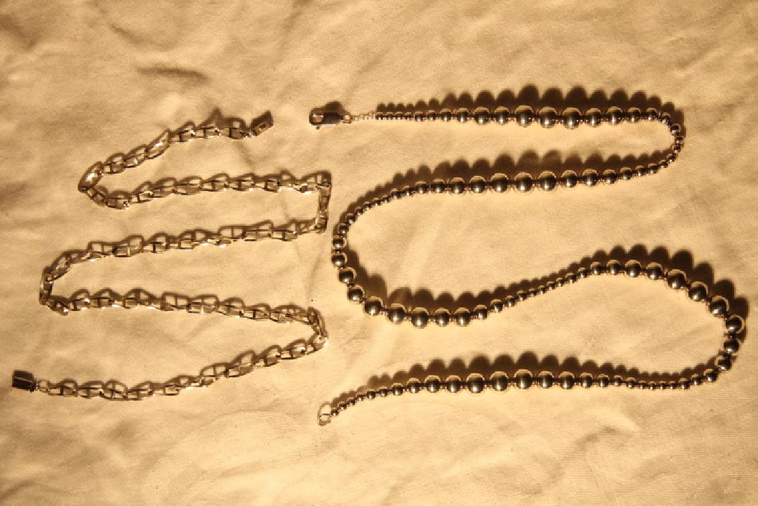 2 Sterling Necklaces: 1. Graduated sterling balls, size is 24 1/2" long 2. Linked chain style, 22" long overall weight is 1.65 ozt
