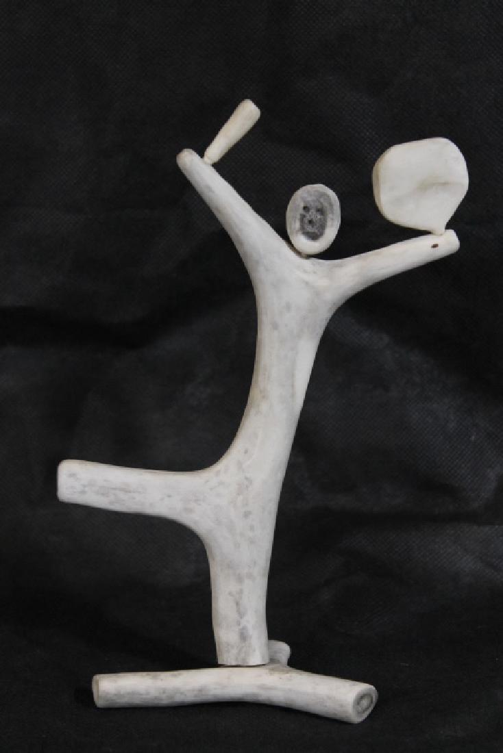 Bone Carving, by Leo Irkok, [Inuit]: Native American bone carving by Leo Irkok, Inuit artist, "Ghost Dancer" or "Drum Dancer", signed on bottom and size is 9 1/2" x 6" wide.