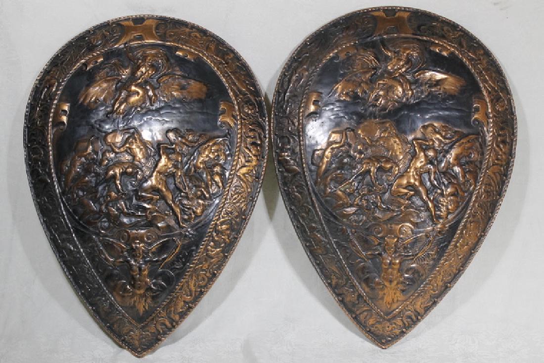 Pr. of Iron Shields: Forces of good and evil, copper over iron shields, foundry mark on reverse, size is 28" x 20", provenance, Hooper Mansion, Walpoe NH