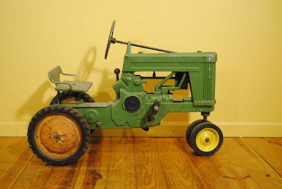 John Deere Pedal Tractor: John Deere tractor, pedal vehicle, chain driven cast frame, rubber wheels, 37" long by 27 1/2" tall
