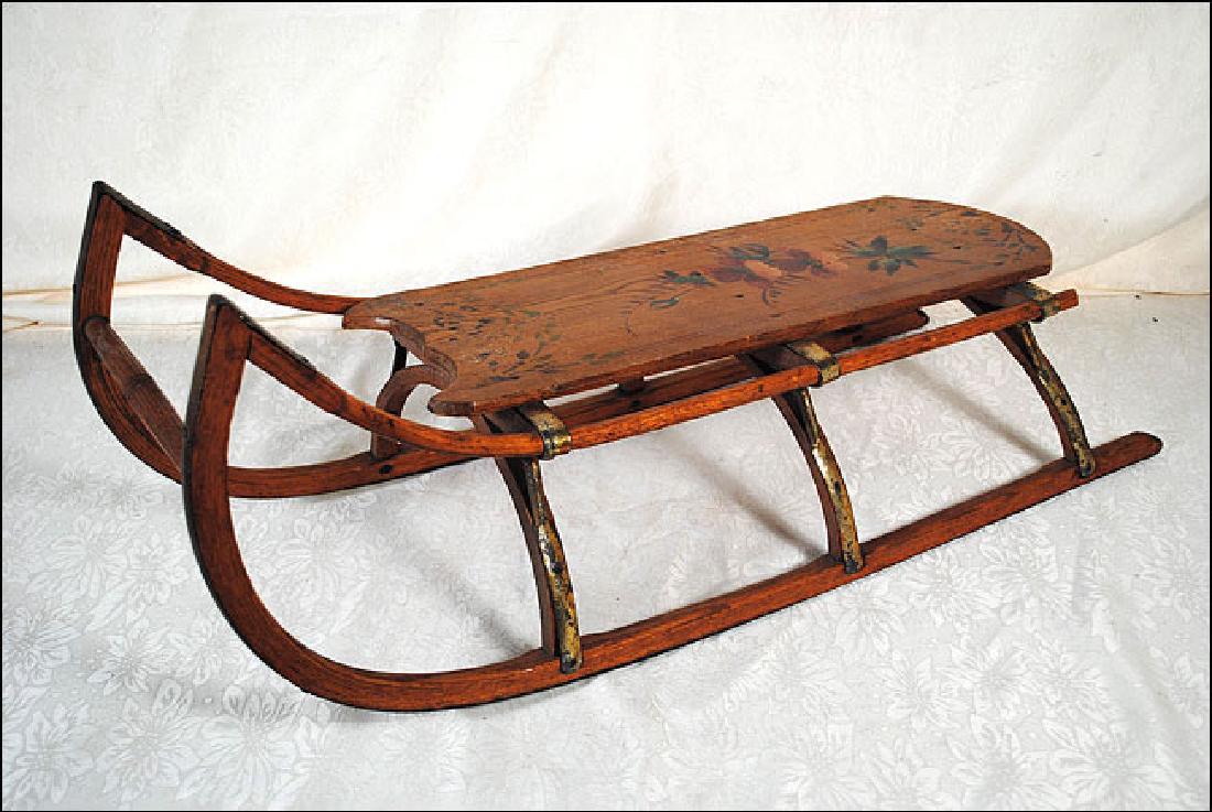 Early Childs Sled: Oak or chestnut childs sled with floral decoration, size is 30" long by 11 1/2" wide