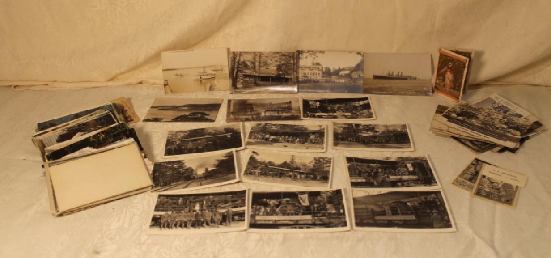 Misc Lot of Earyl Postcards: Misc lot of early postcards, including photo cards of military, boats, burnt out buildings, lakes, houses, along with travel types in color, and an 1878 calendar booklet