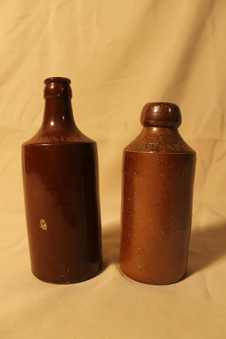 Both stoneware bottles, stamped with Josiah Russell,: Both stoneware bottles, stamped with Josiah Russell, sizes 7 5/8" tall & 6 5/8" tall