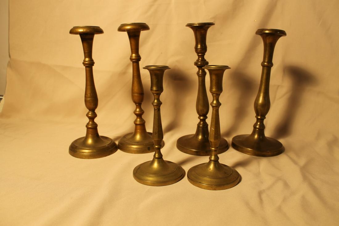 1. 8 1/4" pair brass, matching2. 11 5/8" brass turned,: 1. 8 1/4" pair brass, matching2. 11 5/8" brass turned, matching [one has repair]3. 2- bell metal similar style, 12" tall & 11 1/2" tall