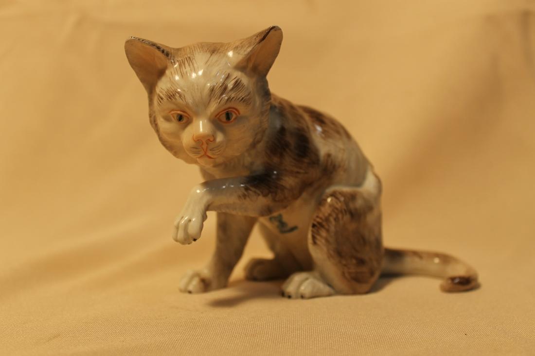 Brown and white porcelain cat 4" tall by 6" long, with (1 of 5)