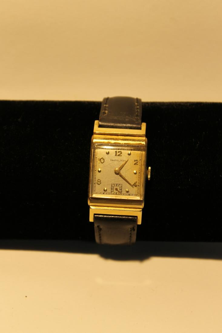 Hamilton mans wrist watch 14kt gold body with leather: Hamilton mans wrist watch 14kt gold body with leather strap manual wind with presentation and dated 1947