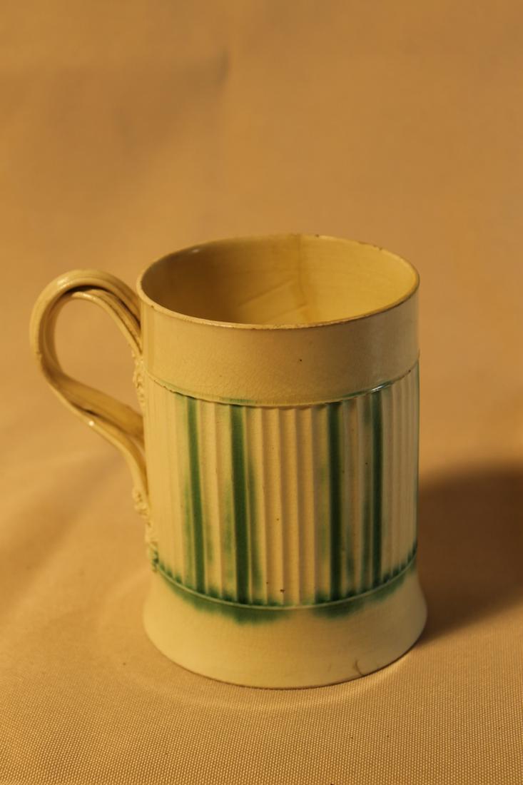 Unsigned creamware mug with green glaze and twisted (1 of 6)